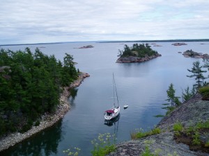 picture of a boat in a peaceful inlet