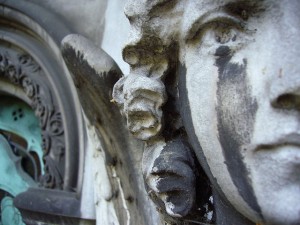 photo of statue of an angel with stains that resemble tears