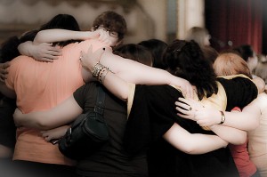 photo of a group of youth hugging