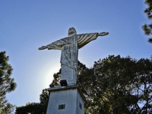 photo of a statue of Jesus with outstretched arms